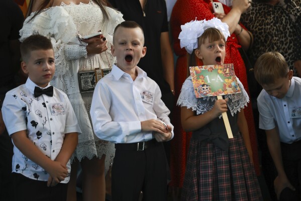 Ukraine’s children return to school as Russia launches drones and ballistic missiles at Kyiv