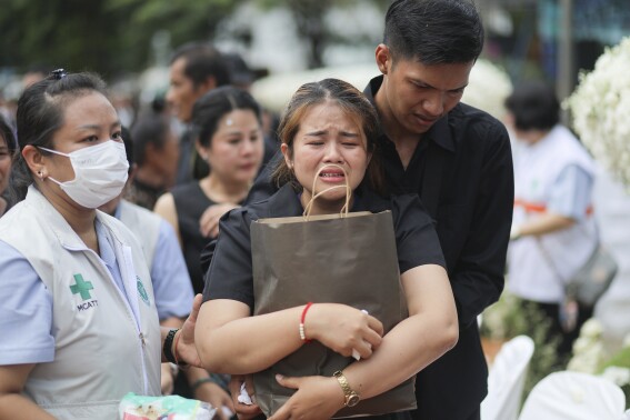 Small town in Thailand hold mass cremation for 23 who died in a school trip bus fire