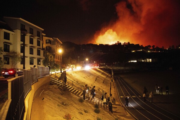 Homes burn as wind-driven wildfire prompts evacuations in Malibu, California